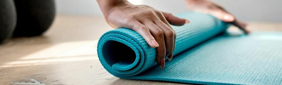 Rolling a yoga mat 